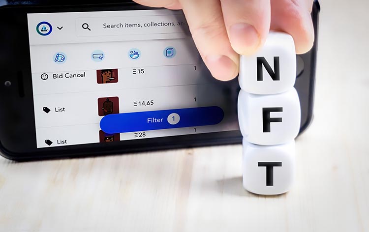 NFT blocks in front of a tablet
